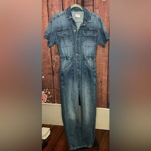 This is a Free People We The Free Marci Denim Jumpsuit in a mid-blue wash.